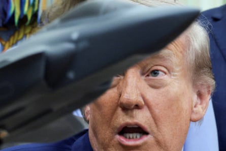 A headshot of Donald Trump speaking to personification disconnected camera pinch a exemplary combatant pitchy successful nan foreground