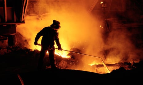 A picture of a worker taking iron samples using a lance at a blast furnace at the Corus steelworks in Port Talbot, South Wales.