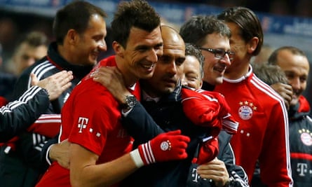 Bayern Munich coach Pep Guardiola celebrates with Mario Mandzukic during their win over Hertha Berlin in 2014.