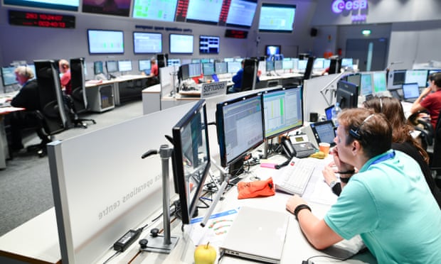 Employees sit in the contol center of the European Space Agency (ESA) in Darmstadt, Germany, Wednesday Oct. 19, 2016. ESA and its Russian partner Roscosmos hope for a successful landing of the joint space probe of mission ExoMars on Mars. (Uwe Ansspach/dpa via AP) Photograph: Uwe Anspach/AP