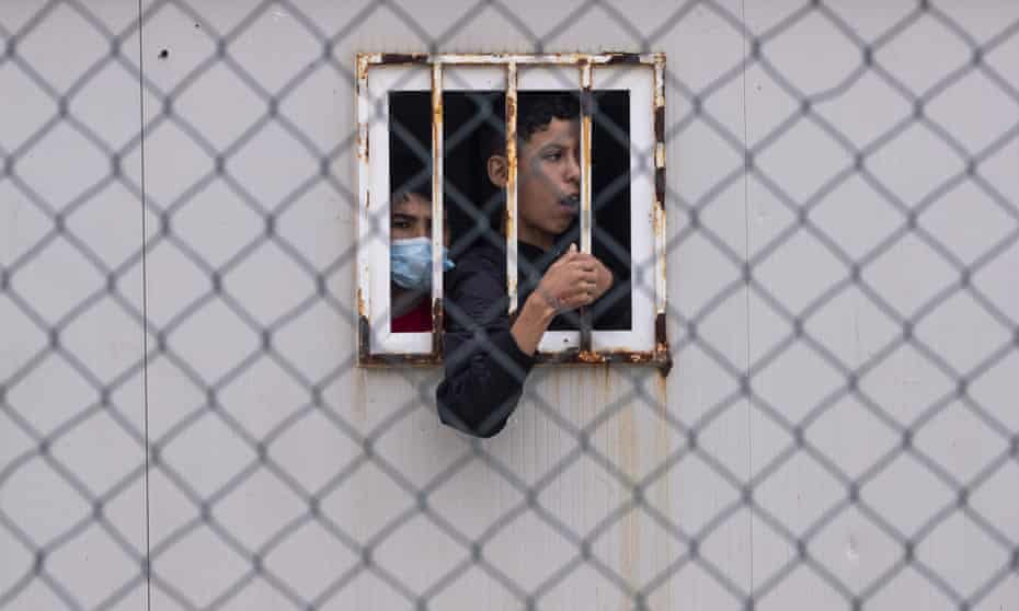 Children who crossed into Spain wait inside a temporary shelter for unaccompanied minors in Ceuta.