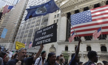 Occupy Wall Street protesters march past the New York Stock Exchange.