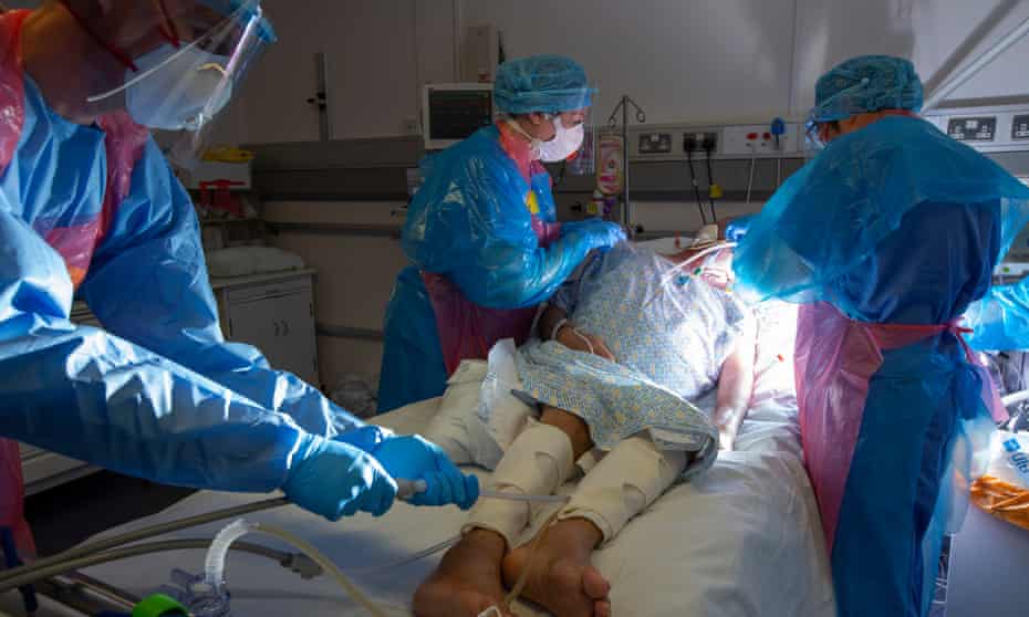 A ventilated Covid patient being washed in hospital