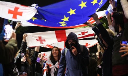 Protesters with Georgian and EU flag