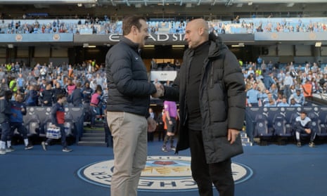 Pep Guardiola and that bloke off of Ted Lasso.