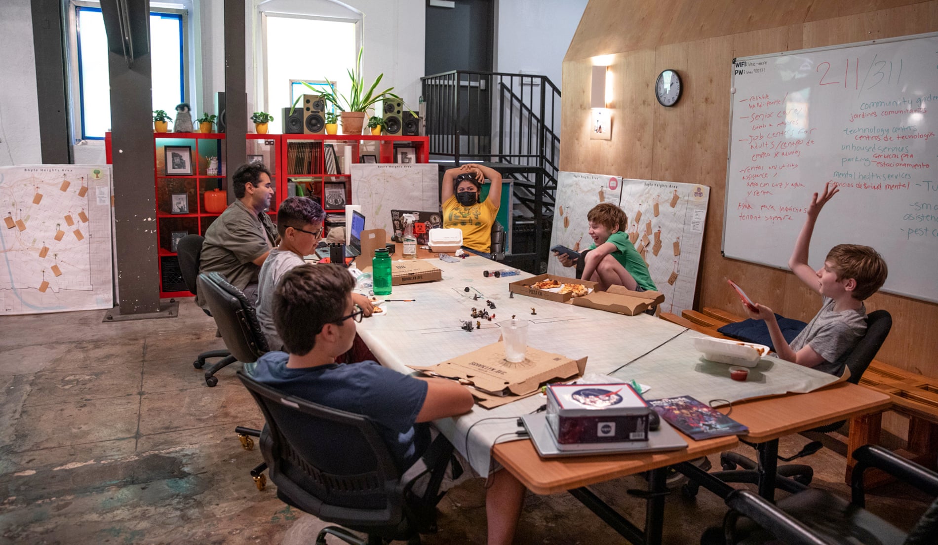 A volunteer at the Boyle Heights Arts Conservatory in Los Angeles leads children in a game of Dungeons and Dragons.