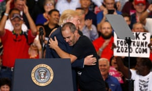 Donald Trump hugs Gene Huber at a “Make America Great Again” rally in Florida.