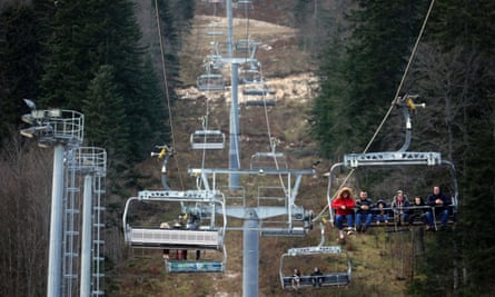 People ride the cable car above a ski run without any snow on Bjelašnica mountain near Sarajevo, Bosnia, on 4 June.