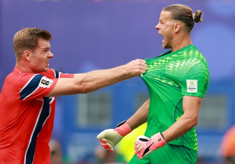 Orjan Nyland of Norway celebrates with Alexander Sorloth after making a penalty save.