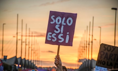 A person holds a banner that reads 'only yes means yes' at an International Women's Day rally in Seville.