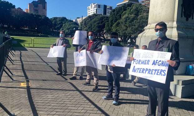 Afghan interpreters lobbying the New Zealand government to bring their families over from Afghanistan, outside parliament in Wellington.