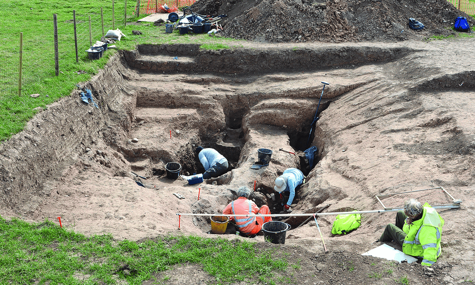 A group of four people working at the archeological site near Loftus