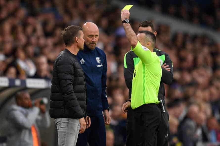 Leeds United 0-4 Manchester City: Premier League – live reaction! | Premier League 6 Referee Paul Tierney shows a yellow card to Leeds coach Jesse Marsch and assistant coach Cameron Toshack.