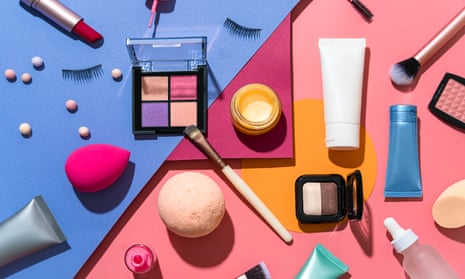 Makeup, beauty and skincare products, including eye shadow, lipstick and brushes, on a colourful background