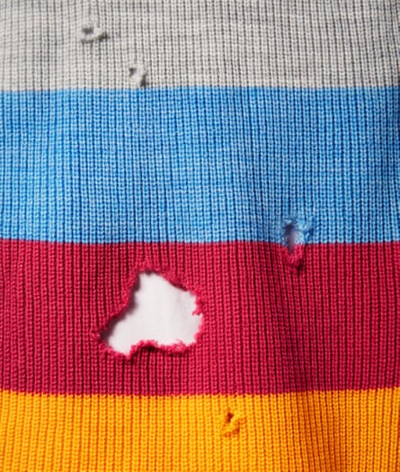 Holes in stripy knitwear