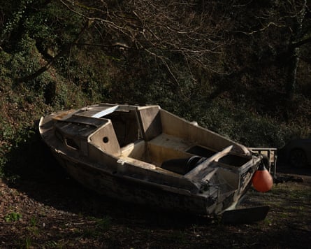 A boat and other objects pulled up on the shore