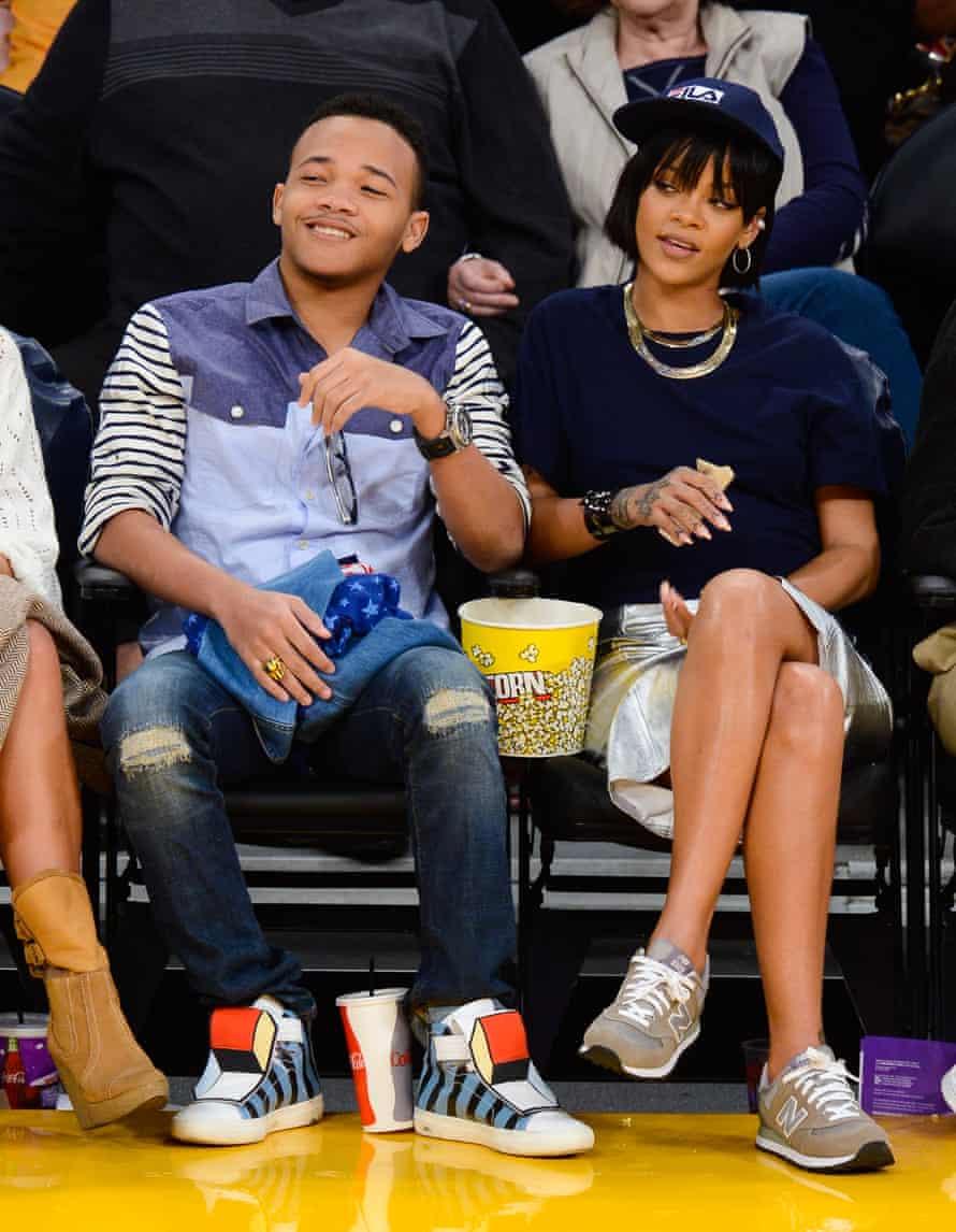 Rihanna, wearing New Balance trainers, and her brother Rajad Fenty