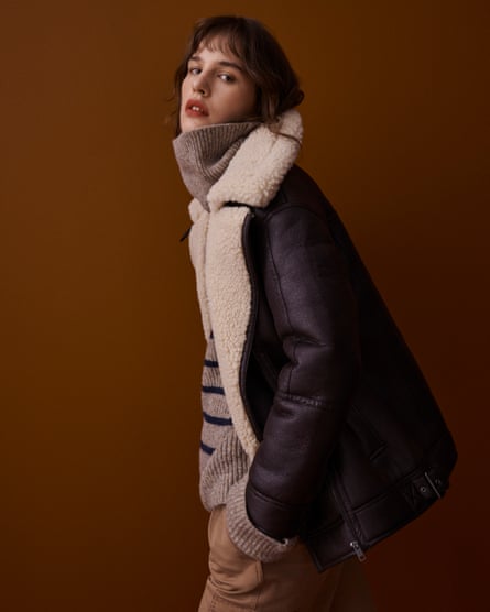 Model wearing clothes from the M&S Collection range: sheepskin lined leather flying jacket, striped jumper, trousers.
