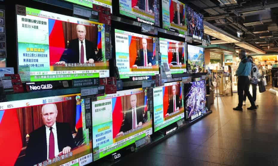 TV screens in Hong Kong broadcast the latest news of Russia’s invasion of Ukraine