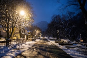 a snowy road in the lamplight