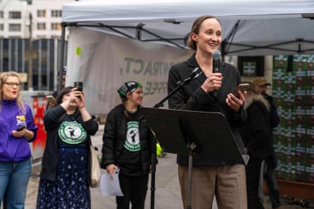 A woman speaks into a microphone.