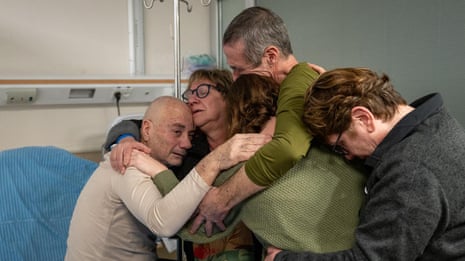 Freed Israeli hostages reunited with family at hospital – video