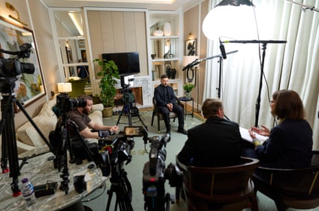 Zelenskyy, Luke Harding and Pippa Crerar and another person with several cameras and lights in living-room-type setting