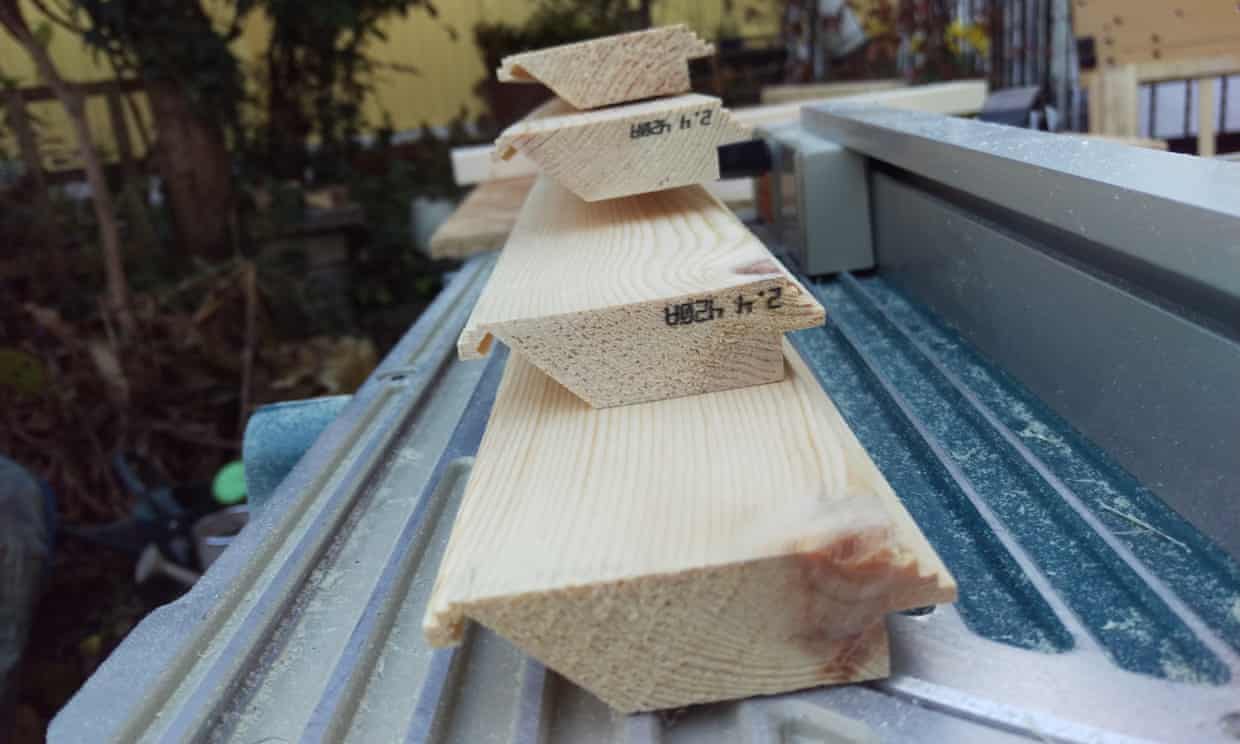 The four pieces of wood that would become the mirror frame, each with a cross-section cut to shape from a plain rectangle through ten passes over a table saw (5 for the decorative step shaping on the top, 2 for the rabbet on the right where the mirror itself will rest, and 3 for the slanted section on the left where the strip of LEDs will go). I couldn’t believe I’d made this - table saws are awesome.