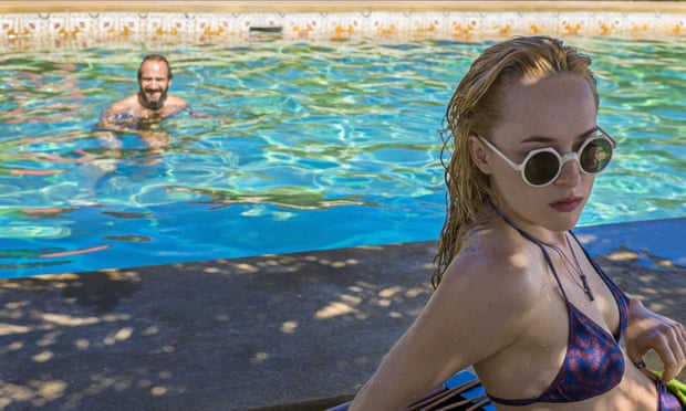 Ralph Fiennes as Harry in A Bigger Splash with Dakota Johnson as his daughter, Penelope