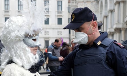 Police officer and masked reveller