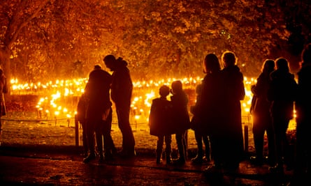 Silhouetted Figures Approaching a Garden of Fire