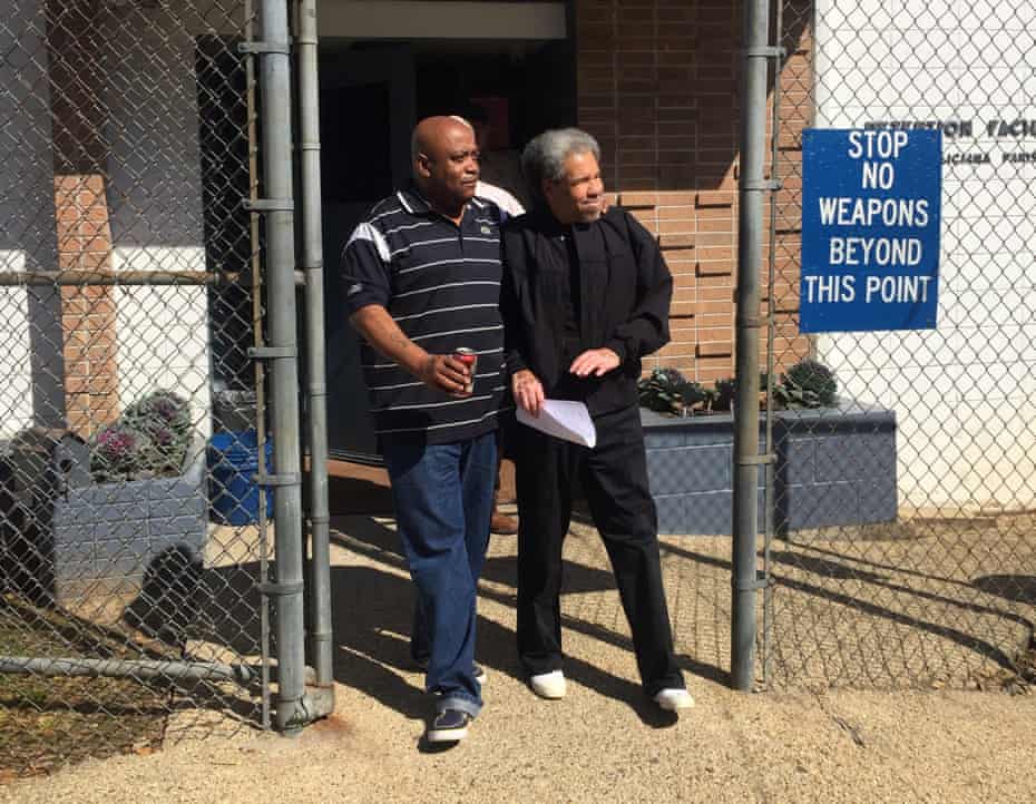 A handout image provided by Squire Patton Boggs and taken by Billy Sothern, the attorney of Albert Woodfox, shows Woodfox, right, being accompanied by his brother Michel Mable, left, as he walks out of the West Feliciana Parish detention center on 19 February 2016.