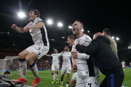 Atalanta’s players celebrate in front of their fans during the 3-0 win at Anfield, a victory that propelled them towards the Europa League semi-finals.