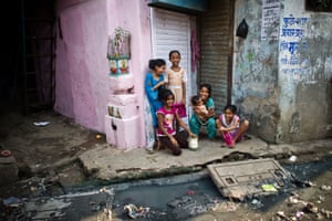 Girls in a doorway in Dharavi slum, photographed in 2011.