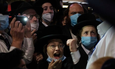 Ultra-Orthodox Jews gather in the Borough Park neighbourhood of Brooklyn to protest against coronavirus restrictions in New York.
