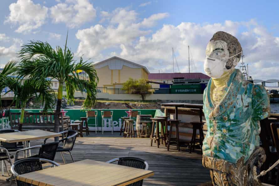 Bar mascot at the Sint Maarten Yacht Club wears a face mask while it is closed due to the Covid-19 pandemic
