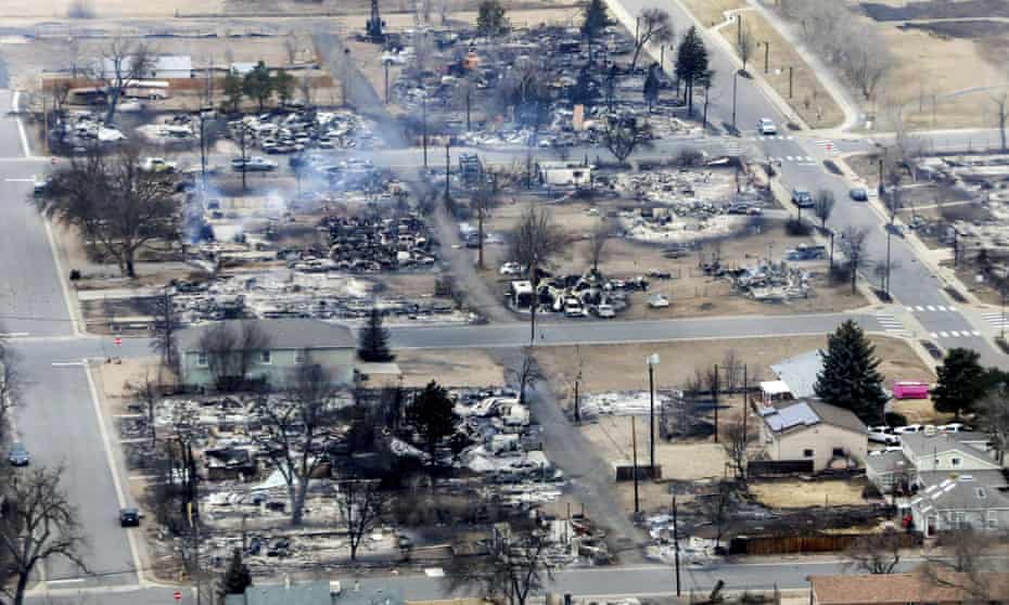 Burned homes in a Boulder county neighborhood destroyed by wildfires seen from a Colorado national guard helicopter on Friday.
