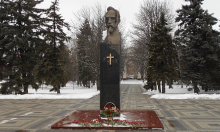A wooden cross on a statue of Felix Dzerzhinsky