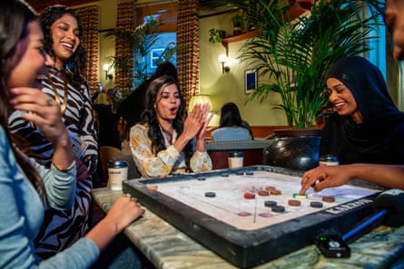 Bushra Shahid claps at the event where strangers come together for some friendly competition