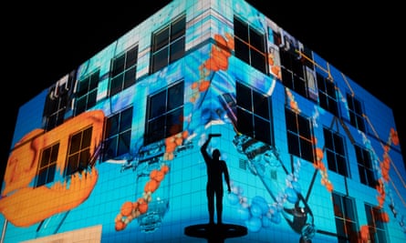 A science-themed animation adorns the walls of Questacon for the Enlighten festival in 2021.