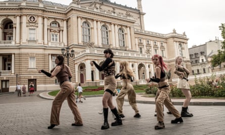 A dance group records a video for J-Pop competition in front of the Odesa opera and ballet theatre.