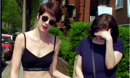 Charlotte Raven in crop top with Julie Burchill shielding her face