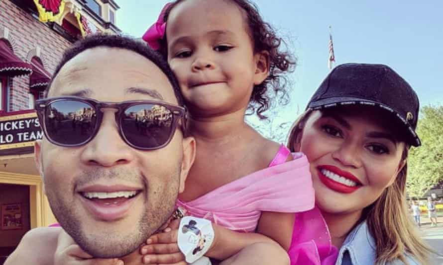 Family man: John Legend in an Instagram post with his daughter Luna and wife Chrissy Teigen.
