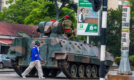 An armoured personnel carrier patrols the streets of Harare after the army takeover of the capital.