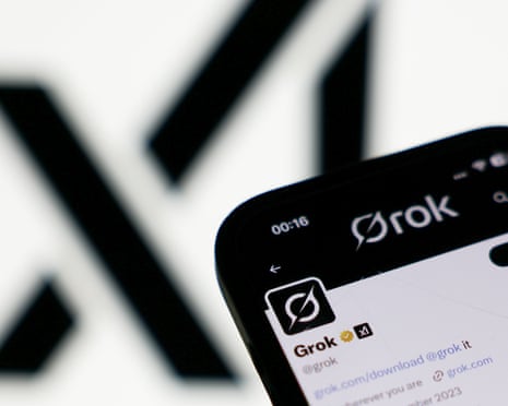 xAI logo dislpayed on a screen and Grok account on X displayed on a phone screen.