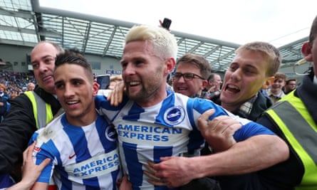 Oliver Norwood (right) on the field following Brighton’s promotion in 2017.