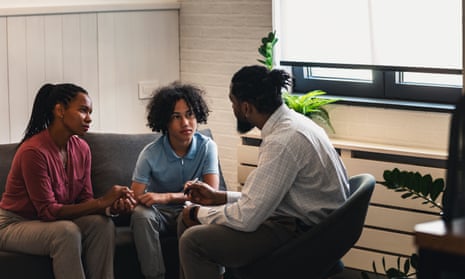Woman with teen son have a meeting with psychologist, psychotherapist sessionAfrican American woman with teen son have a meeting with psychologist. A psychotherapist session with a patient. mother seeks professional help for her teenage son