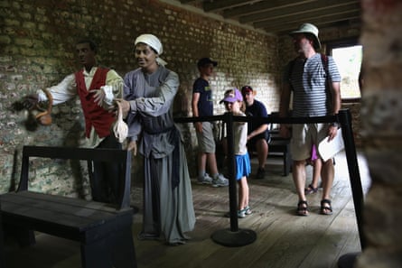 Tourists look over mannequins in the former slave quarters of the Boone Hall Plantation in Mount Pleasant, South Carolina.