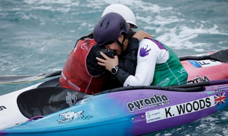 Kimberley Woods of Great Britain (facing) cries on the shoulder of runner-up Camille Prigent of France as she celebrates winning the gold medal in the final of the womens kayak cross.