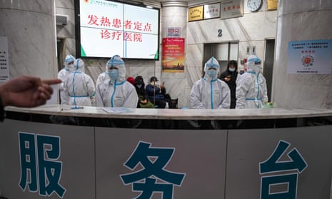 Staff at a hospital in Wuhan on 25 January 2020